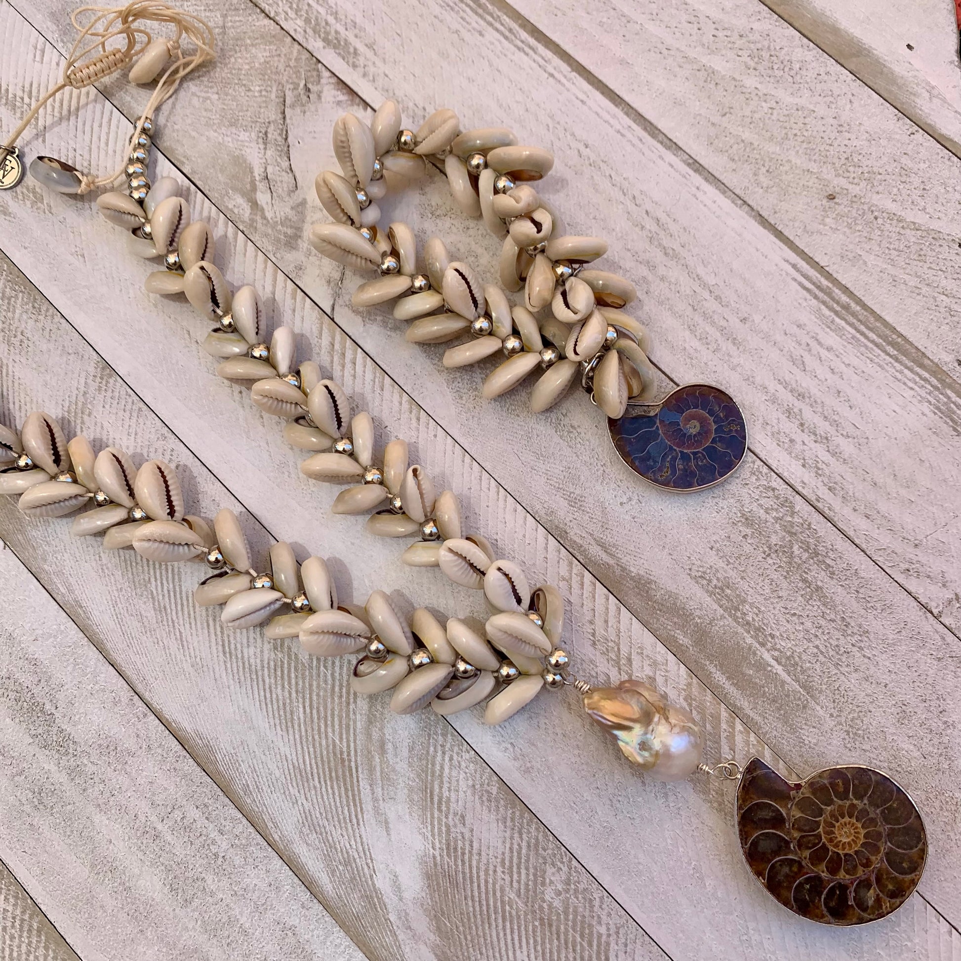 Puka Shells Stretchy Bracelet with One of a Kind Fossilized Ammonite Shell Pendant