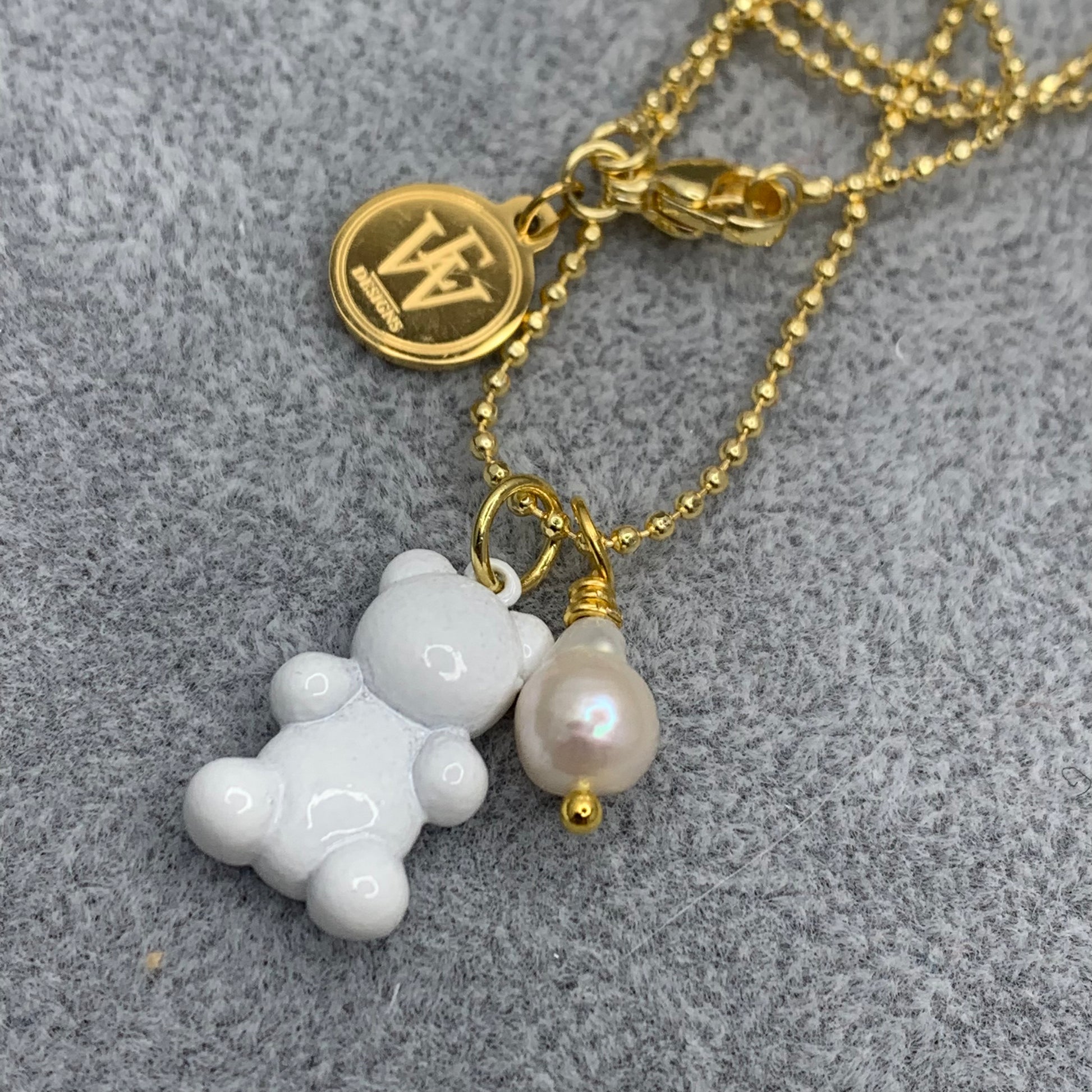 Ball and chain necklace with white enameled gummy bear pendant